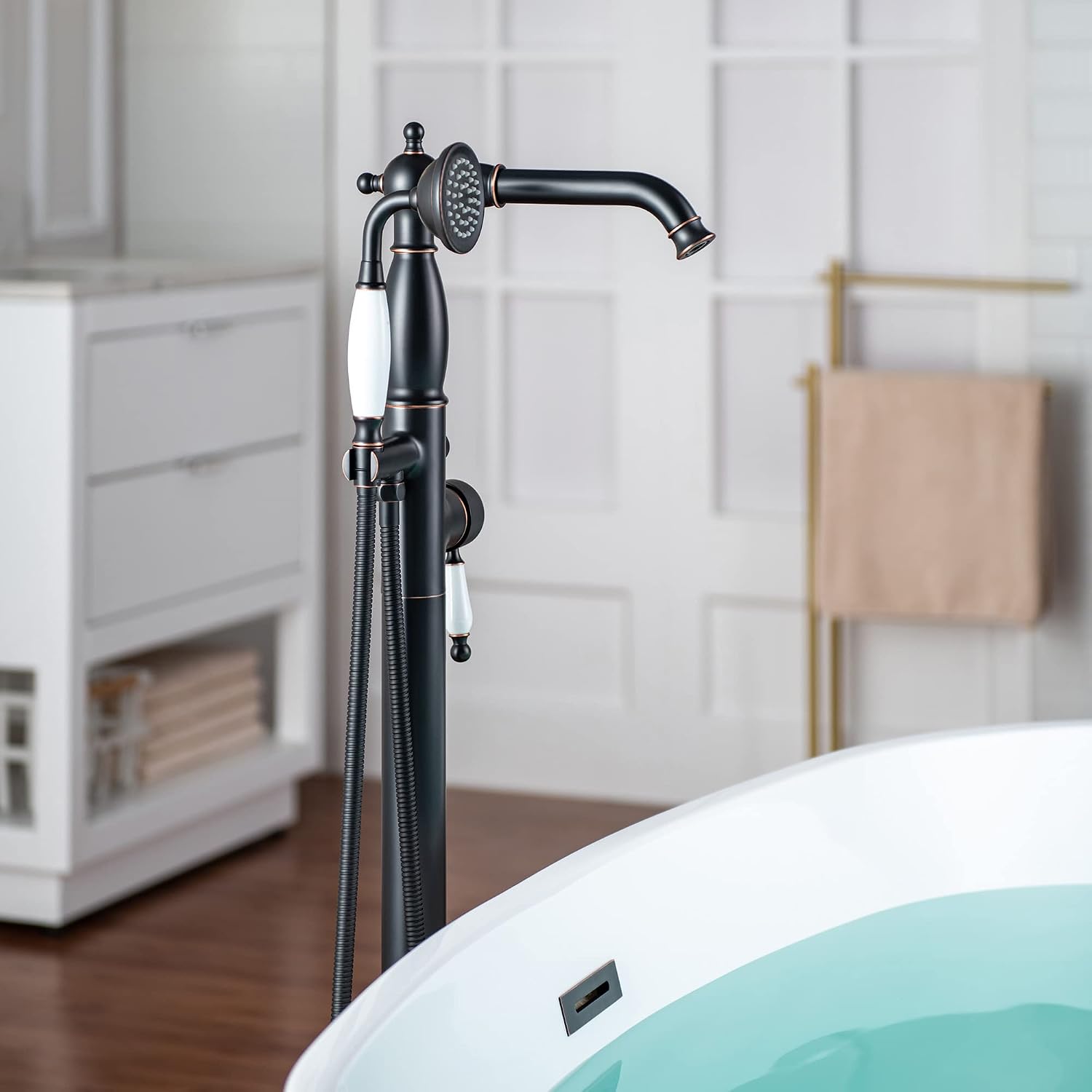 WOODBRIDGE Contemporary Single Handle Floor Mount Freestanding Tub Filler Faucet with Hand Shower in Oil Rubbed Bronze Finish