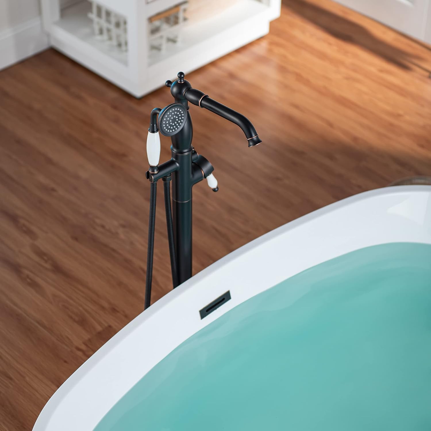 WOODBRIDGE Contemporary Single Handle Floor Mount Freestanding Tub Filler Faucet with Hand Shower in Oil Rubbed Bronze Finish
