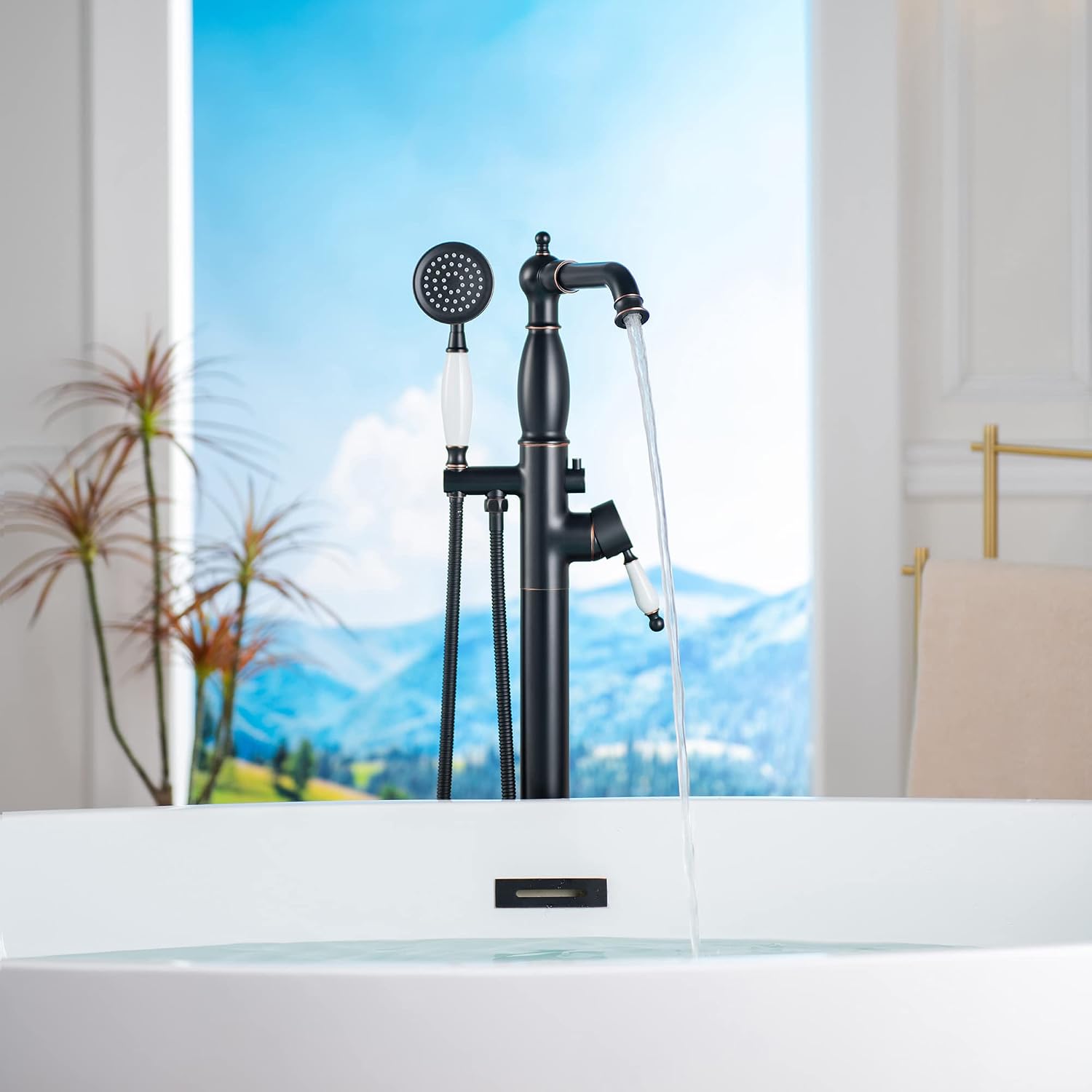 WOODBRIDGE Contemporary Single Handle Floor Mount Freestanding Tub Filler Faucet with Hand Shower in Oil Rubbed Bronze Finish