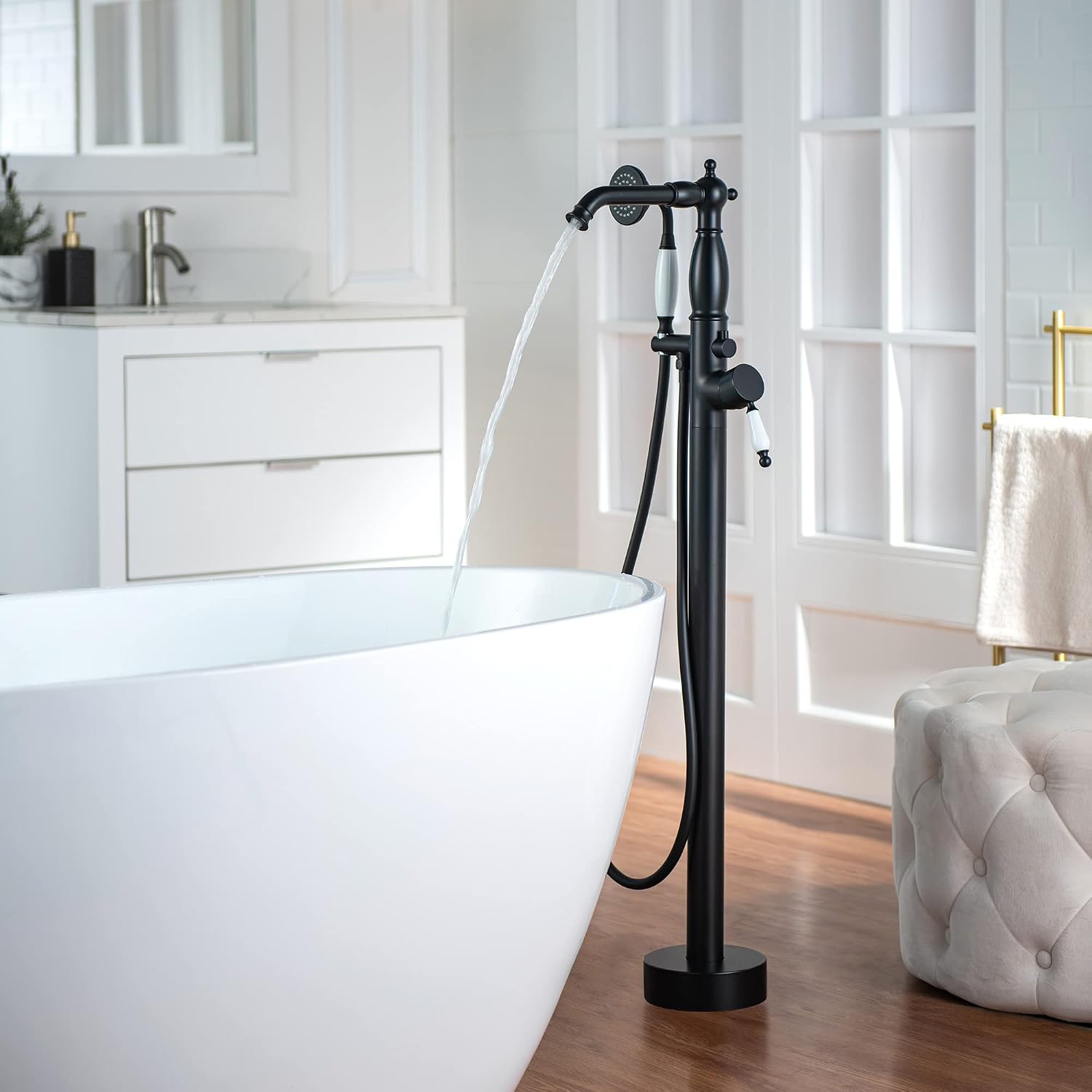 WOODBRIDGE Contemporary Single Handle Floor Mount Freestanding Tub Filler Faucet with Hand Shower in Matte Black Finish