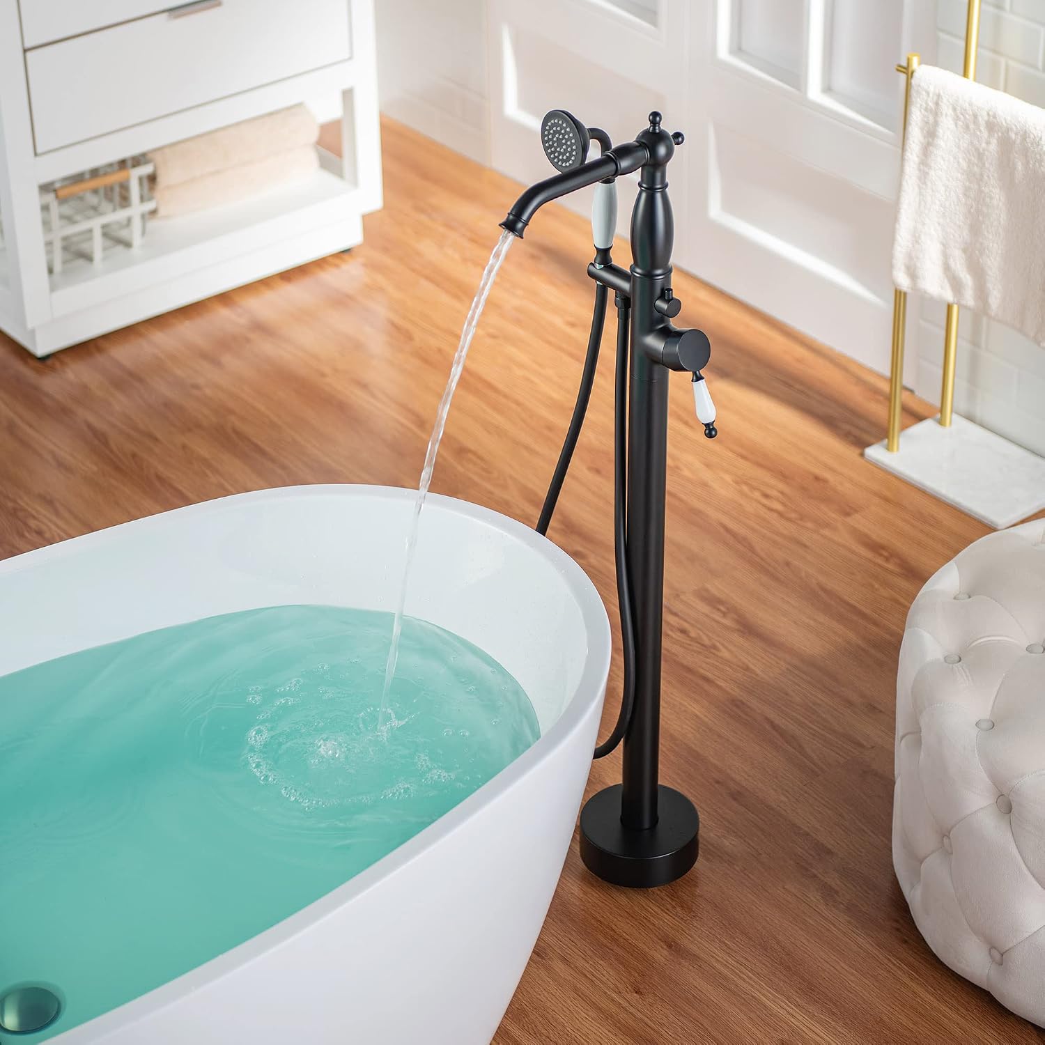 WOODBRIDGE Contemporary Single Handle Floor Mount Freestanding Tub Filler Faucet with Hand Shower in Matte Black Finish