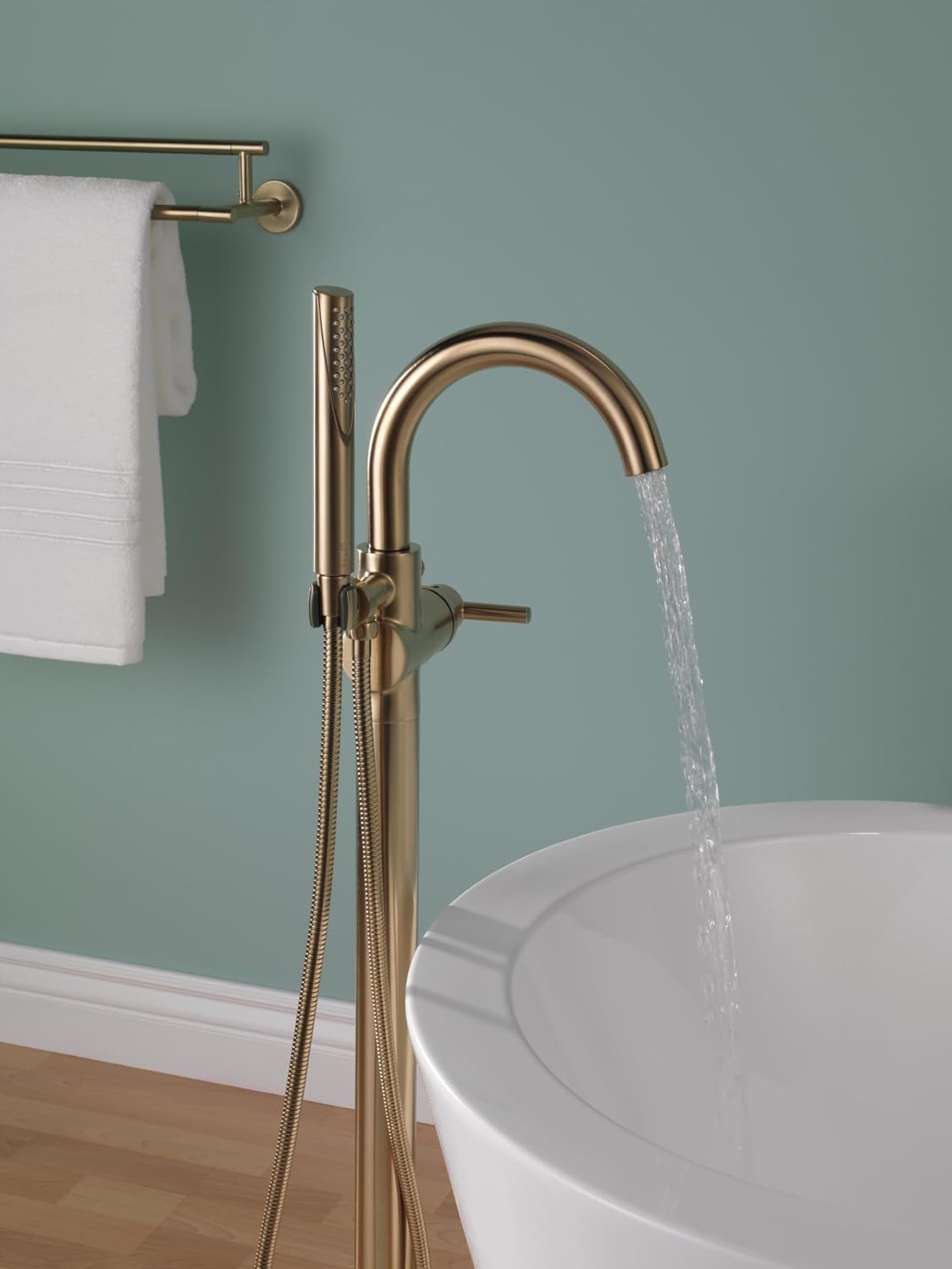 Delta Faucet Trinsic Floor Mount Tub Filler - Freestanding Roman Tub Spout with Handheld Shower - Flexible Shower Hose - Double Check Valves - Champagne Bronze, T4759-CZFL (Rough Sold Separately)
