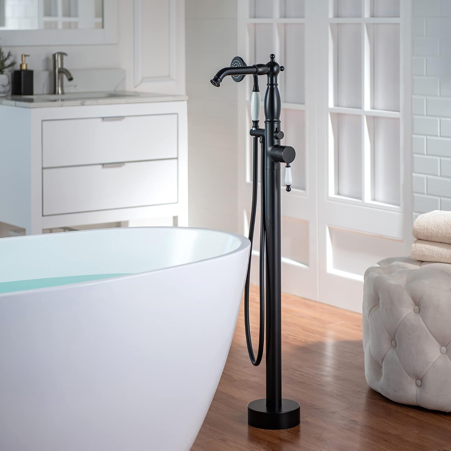WOODBRIDGE Contemporary Single Handle Floor Mount Freestanding Tub Filler Faucet with Hand Shower in Matte Black Finish