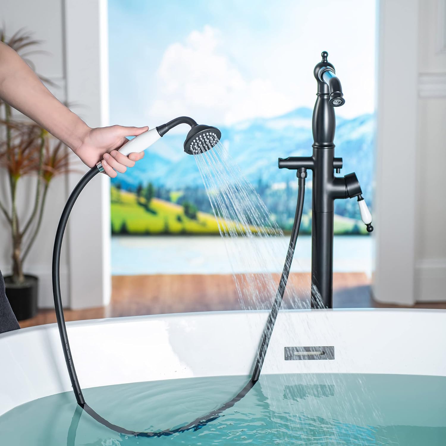 WOODBRIDGE Contemporary Single Handle Floor Mount Freestanding Tub Filler Faucet with Hand Shower in Matte Black Finish